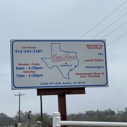 E & L Tacos - Sign at entrance with hours