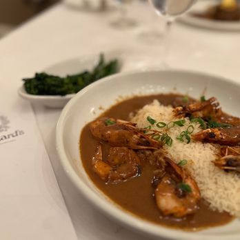 Broussard's Restaurant & Courtyard - New Orleans Barbecued Shrimp w/ Louisiana Popcorn Rice and a side of Broccolini - Seafood Near Me - New Orleans, Louisiana Broussard's Restaurant & Courtyard - New Orleans Barbecued Shrimp w/ Louisiana Popcorn Rice and a side of Broccolini - Seafood Near Me - New Orleans, Louisiana