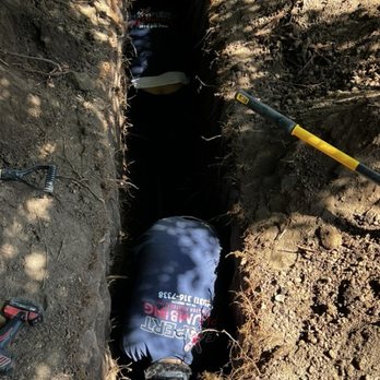 Expert Plumbing & Water Heaters - Jarred and Jose making the connection in the 4' trench - Plumbing Near Me Expert Plumbing & Water Heaters - Jarred and Jose making the connection in the 4' trench - Plumbing Near Me
