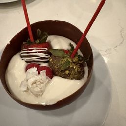 Chocolate shell filled with cream and chocolate strawberries - one of which was a Dubai chocolate strawberry! 9/10