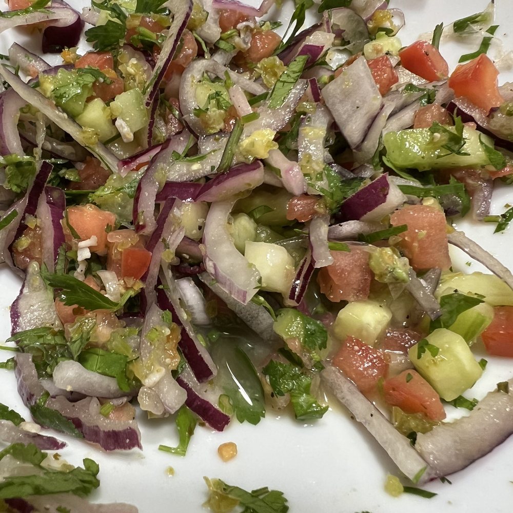 Mi Vallarta - a white plate with a salad on it - Seafood Near Me - South Elgin, Illinois Mi Vallarta - a white plate with a salad on it - Seafood Near Me - South Elgin, Illinois