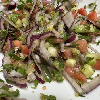 Mi Vallarta - a white plate with a salad on it - Seafood Near Me - South Elgin, Illinois Mi Vallarta - a white plate with a salad on it - Seafood Near Me - South Elgin, Illinois
