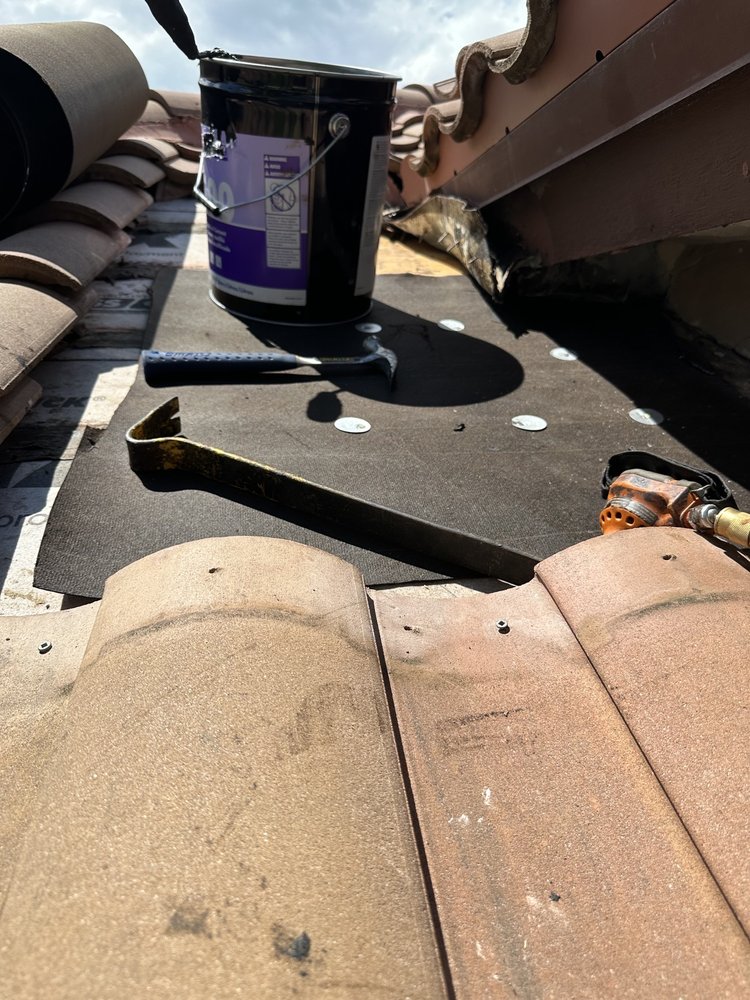 Slide of MC Roofing Service