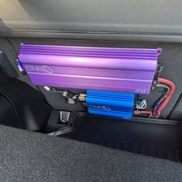 2 amplifiers mounted to rear back seat. Neat and tucked away. 2 amplifiers mounted to rear back seat. Neat and tucked away.