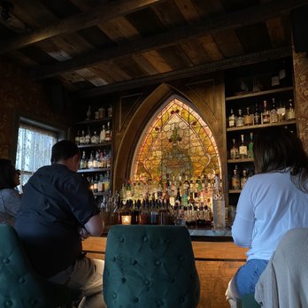 The Junto Attic Bar - people sitting at the bar - Speakeasies Near Me - Jersey City, New Jersey