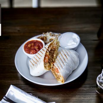 Neomaya - a burrito on a plate with a side of salsa - New American Near Me - Pensacola Beach, Florida Neomaya - a burrito on a plate with a side of salsa - New American Near Me - Pensacola Beach, Florida