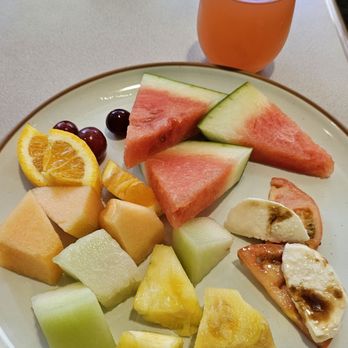 Cafe 410 - Round 1: POG juice (passion orange guava), caprese salad, and fresh fruits - American Near Me - Honolulu, Hawaii