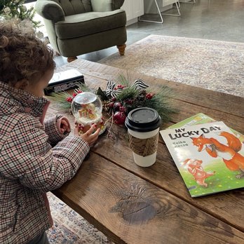 Stacked Coffeehouse - My toddler checking out their Christmas decor and books they had for kids - Cafes Near Me - Villa Ridge, Missouri