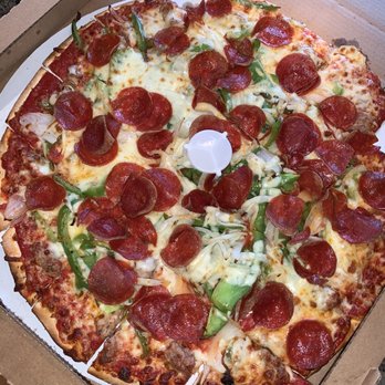 Moretti's Ristorante and Pizzeria - Pepperoni, pepper, onion thin crust pizza - Italian Near Me - Chicago, Illinois