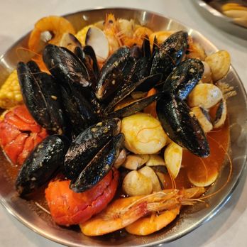 Storming Crab - AYCE with lobster (1st order only), mussel shells , boiled eggs, clams, corn, head on shrimps with combination sauce - Seafood Near Me - Henderson, Nevada Storming Crab - AYCE with lobster (1st order only), mussel shells , boiled eggs, clams, corn, head on shrimps with combination sauce - Seafood Near Me - Henderson, Nevada