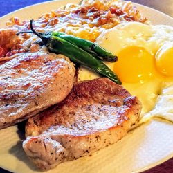 Aunt Yese's Home Cooking - Chops and eggs with chilli cheese hash - tender with good flavor. Added grilled serrano chili peppers for a kick