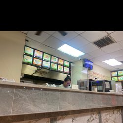 Ming Gardens Restaurant - Inside if restaurant ; employee .