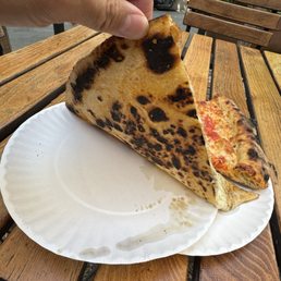 Undercarriage of cacio e Pepe slice