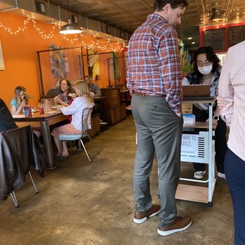 The Fiction Kitchen - a man and a woman standing in a restaurant - Vegan Near Me - Raleigh, North Carolina The Fiction Kitchen - a man and a woman standing in a restaurant - Vegan Near Me - Raleigh, North Carolina