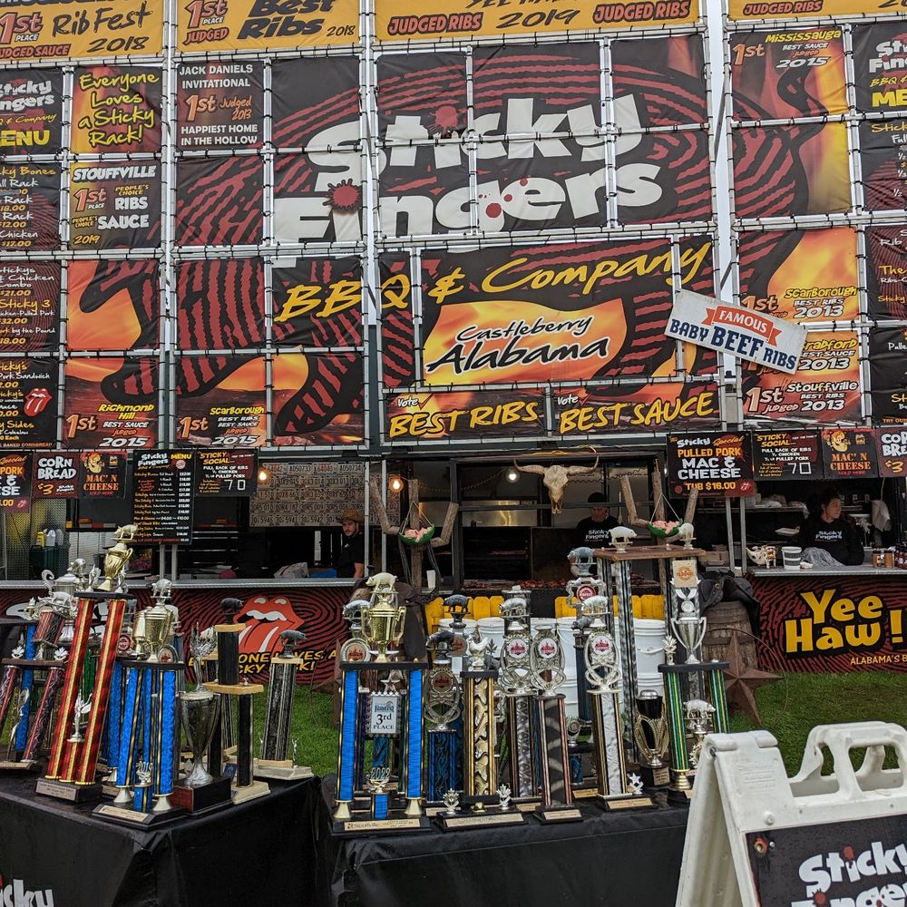 Canada's Largest Ribfest - Stick Fingers booth - check out the trophies! - Festivals Near Me - Burlington, Ontario
