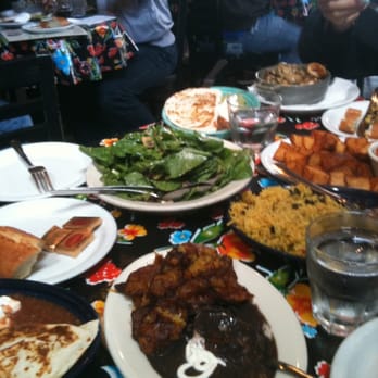 Cha Cha Cha - Crowded table with enough plates to feed six. - Caribbean Near Me - San Francisco, California Cha Cha Cha - Crowded table with enough plates to feed six. - Caribbean Near Me - San Francisco, California