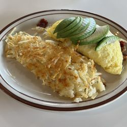 AJ's Cafe & Grill - Avocado, Bacon, and cheese omelette with hash browns
