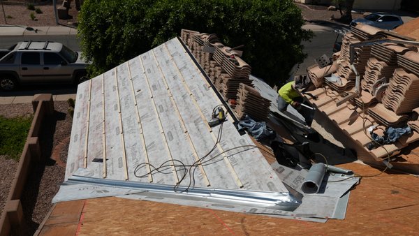 Underlayment Replacement In Chandler, AZ - Dwell Roof performed a tile roof underlayment replacement in Chandler Arizona. The tile was mostly fine, but the underlayment had expired under the Arizona heat and UV. Dwell detached the tile, removed all the old flashings, underlayment, metal and battens and then replaced it all new. Underlayment Replacement In Chandler, AZ - Dwell Roof performed a tile roof underlayment replacement in Chandler Arizona. The tile was mostly fine, but the underlayment had expired under the Arizona heat and UV. Dwell detached the tile, removed all the old flashings, underlayment, metal and battens and then replaced it all new.