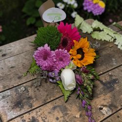 My Little Posy - A beautiful play on texture. Bright sunflowers and magenta blooms are balanced by velvet-green accents in this signature wrap.