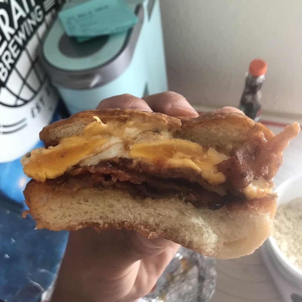 Breakfast sandwich, bacon egg cheese, salt pepper ketchup Breakfast sandwich, bacon egg cheese, salt pepper ketchup