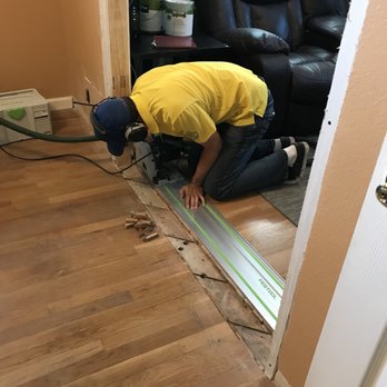 Pyle Legacy Floors - a man working on a hardwood floor - Flooring Near Me Pyle Legacy Floors - a man working on a hardwood floor - Flooring Near Me