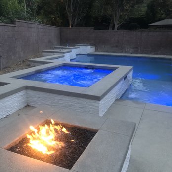 OC Poolscapes - Fire pit, lit pool at dusk - Pool & Hot Tub Service Near Me - La Mirada, California