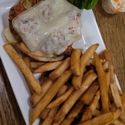 Paddy's Brewpub & Rosie's Restaurant - Butter chicken burger with fries