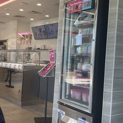 Dunkin' - A fully stocked ice cream(cake) freezer.