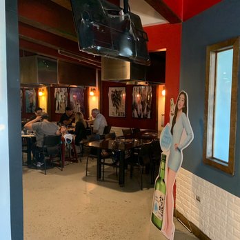 BBQ Hut Restaurant - a woman standing in a restaurant - Barbeque Near Me - Hoffman Estates, Illinois