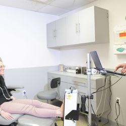 Premier Podiatry Velimir Petkov, DPM - Dr. Velimir Petkov scanning a patient's feet for custom orthotics.
