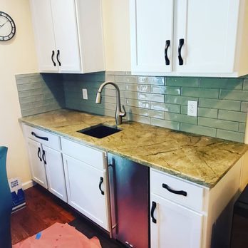 All Floor One - a kitchen with white cabinets and marble counter tops - Tiling Near Me - Marlboro, New York All Floor One - a kitchen with white cabinets and marble counter tops - Tiling Near Me - Marlboro, New York