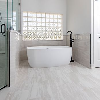 Royal Remodeling & Design - a bathtub in a bathroom - Kitchen & Bath Near Me - Sarasota, Florida Royal Remodeling & Design - a bathtub in a bathroom - Kitchen & Bath Near Me - Sarasota, Florida
