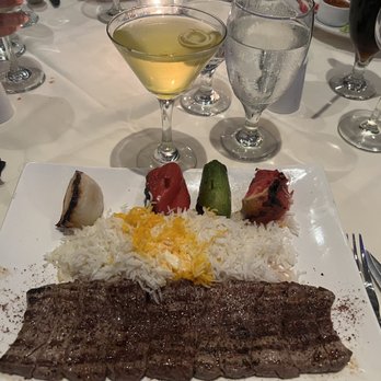 Bha! Bha! Persian Bistro - Barg kabob (Beef) with saffron infused basmati rice & veggies. Mango cocktail on side. - Middle Eastern Near Me - Naples, Florida Bha! Bha! Persian Bistro - Barg kabob (Beef) with saffron infused basmati rice & veggies. Mango cocktail on side. - Middle Eastern Near Me - Naples, Florida