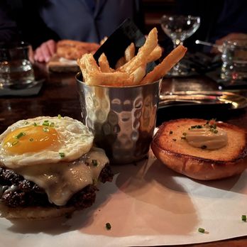 The Blind Rabbit - Burger with fries and my friend in the background has fish and chips - Cocktail Bars Near Me - Anaheim, California The Blind Rabbit - Burger with fries and my friend in the background has fish and chips - Cocktail Bars Near Me - Anaheim, California