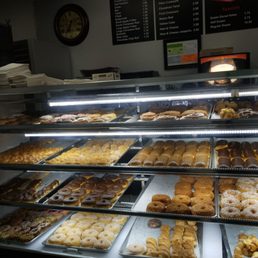 a variety of donuts in a display case a variety of donuts in a display case