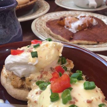 Another Broken Egg Cafe - Crab cake benedict with the peach cobbler pancake in the background. Very yummy! - Breakfast & Brunch Near Me - Clearwater Beach, Florida