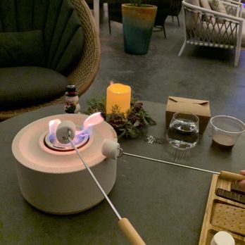 Anaqua Garden Bar - Roasting marshmallows for s'mores - Bars Near Me - San Antonio, Texas