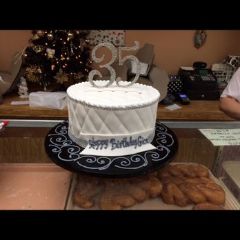 Giuseppe's Bakery - a white cake on a black plate - Bakeries Near Me - Eastpointe, Michigan