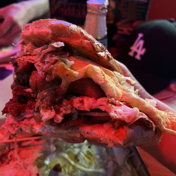 CHeve & BarbaCHa - a hand holding a sandwich - Mexican Near Me - Moreno Valley, California