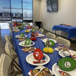 H-Town Elite Gymnastics - Table set up! The blue tablecloth, white napkins and white plates were provided. We brought the Mario decor