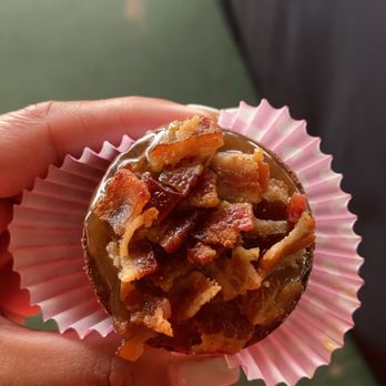 M's Sweets n Treats - a person holding a muffin - Desserts Near Me