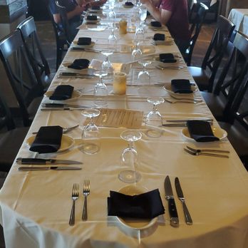 Table at Poipu - Us, waiting for the rest of our party. - New American Near Me - Koloa, Hawaii