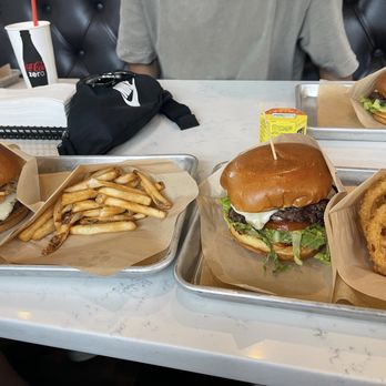 Craft Burger by Shane - Kpop burger (left) with fries, Craft Classic Burger (right) with onion rings - Salad Near Me - Johns Creek, Georgia Craft Burger by Shane - Kpop burger (left) with fries, Craft Classic Burger (right) with onion rings - Salad Near Me - Johns Creek, Georgia