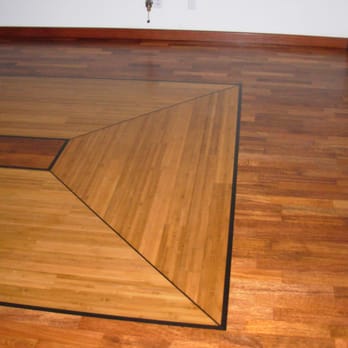 Abed's Flooring - Wood floor rug made of bamboo and ebonied mahogany, set in an existing merbau floor. - Flooring Near Me Abed's Flooring - Wood floor rug made of bamboo and ebonied mahogany, set in an existing merbau floor. - Flooring Near Me