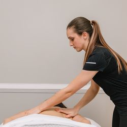 Knead to Unwind - Gabrielle giving a therapeutic massage, which can help with muscle pain, joint pain, headaches, stress/anxiety and can improve sleep quality