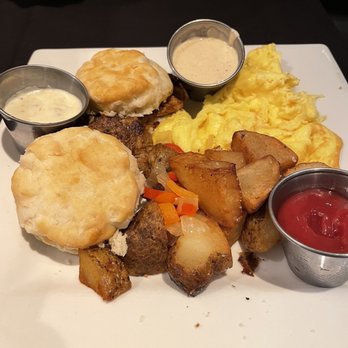 Midtown Cafe - Nashville Pig in a Blanket with home fries and fresh biscuits with pork tenderloin - Breakfast & Brunch Near Me - Nashville, Tennessee Midtown Cafe - Nashville Pig in a Blanket with home fries and fresh biscuits with pork tenderloin - Breakfast & Brunch Near Me - Nashville, Tennessee