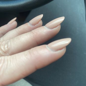 Joy Nails & Spa - You can see the glue sticking out from under the nail and peeling off next to my cuticle. - Nail Salons Near Me - Oceanside, California