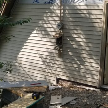 Nailed It Construction - Lake house during siding - General Contractors Near Me