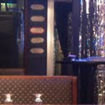 Downtown Olly's - only at olly's will you find country sayings on the wall next to glittery streamer curtains. - American Near Me - Indianapolis, Indiana
