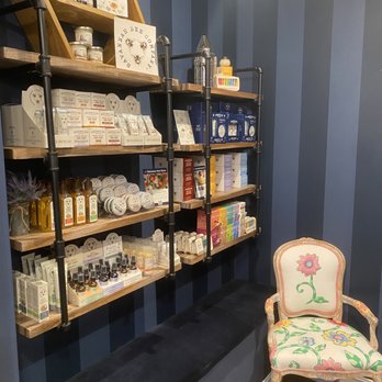 Grand Central Honey - a chair in front of a wall of shelves - Honey Near Me - Naples, Florida Grand Central Honey - a chair in front of a wall of shelves - Honey Near Me - Naples, Florida